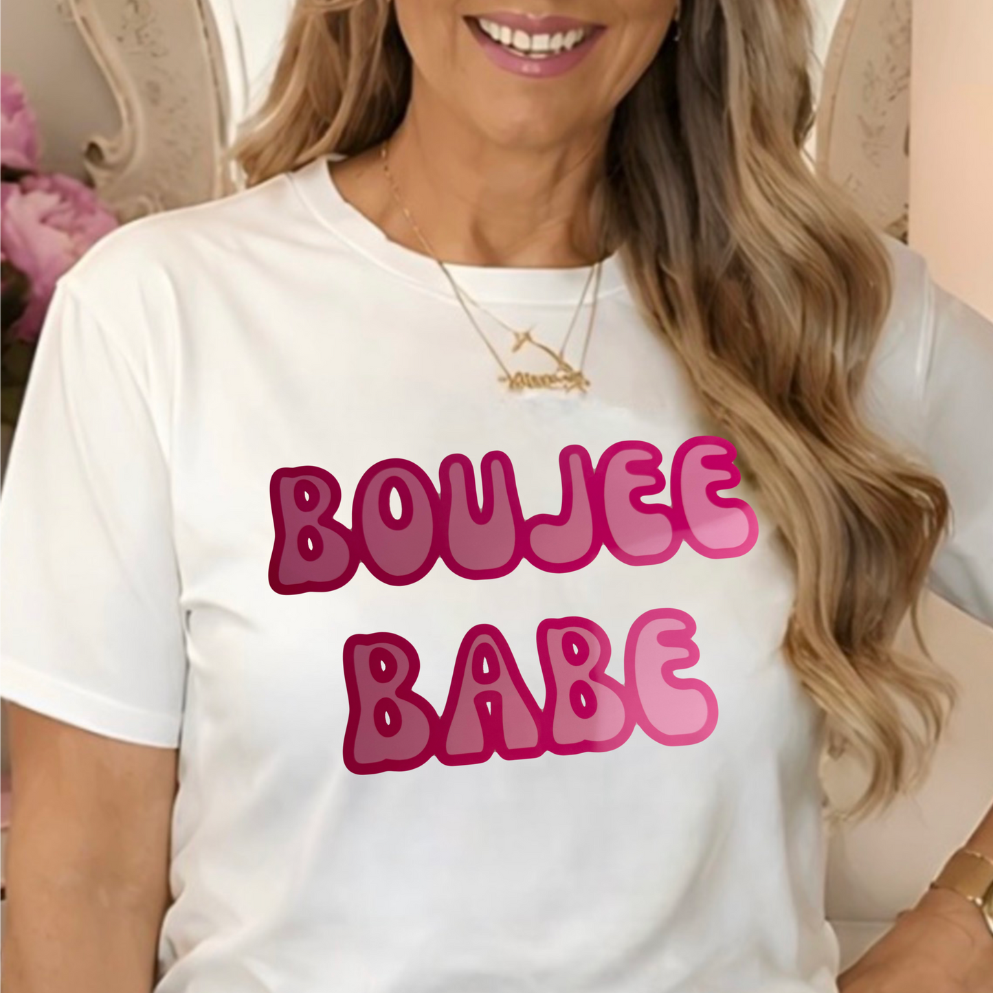 a white graphic t-shirt with 'BOUJEE BABE' printed in pink bubble letters.