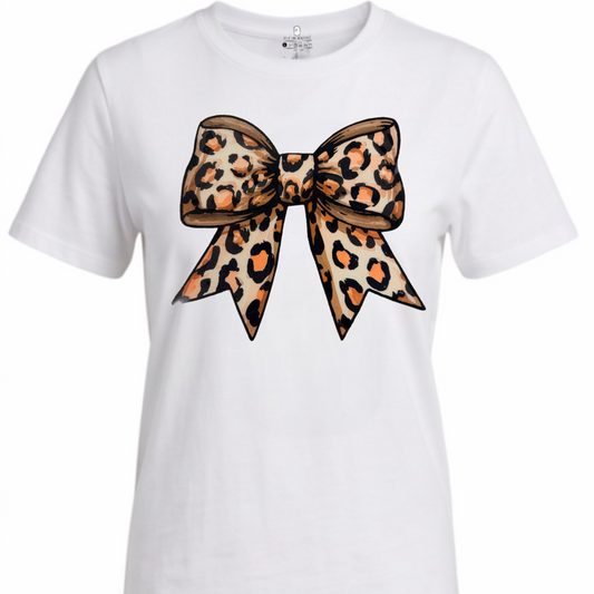 A white short-sleeve crewneck t-shirt featuring a large leopard-print bow graphic printed on the front, displayed against a solid white background.