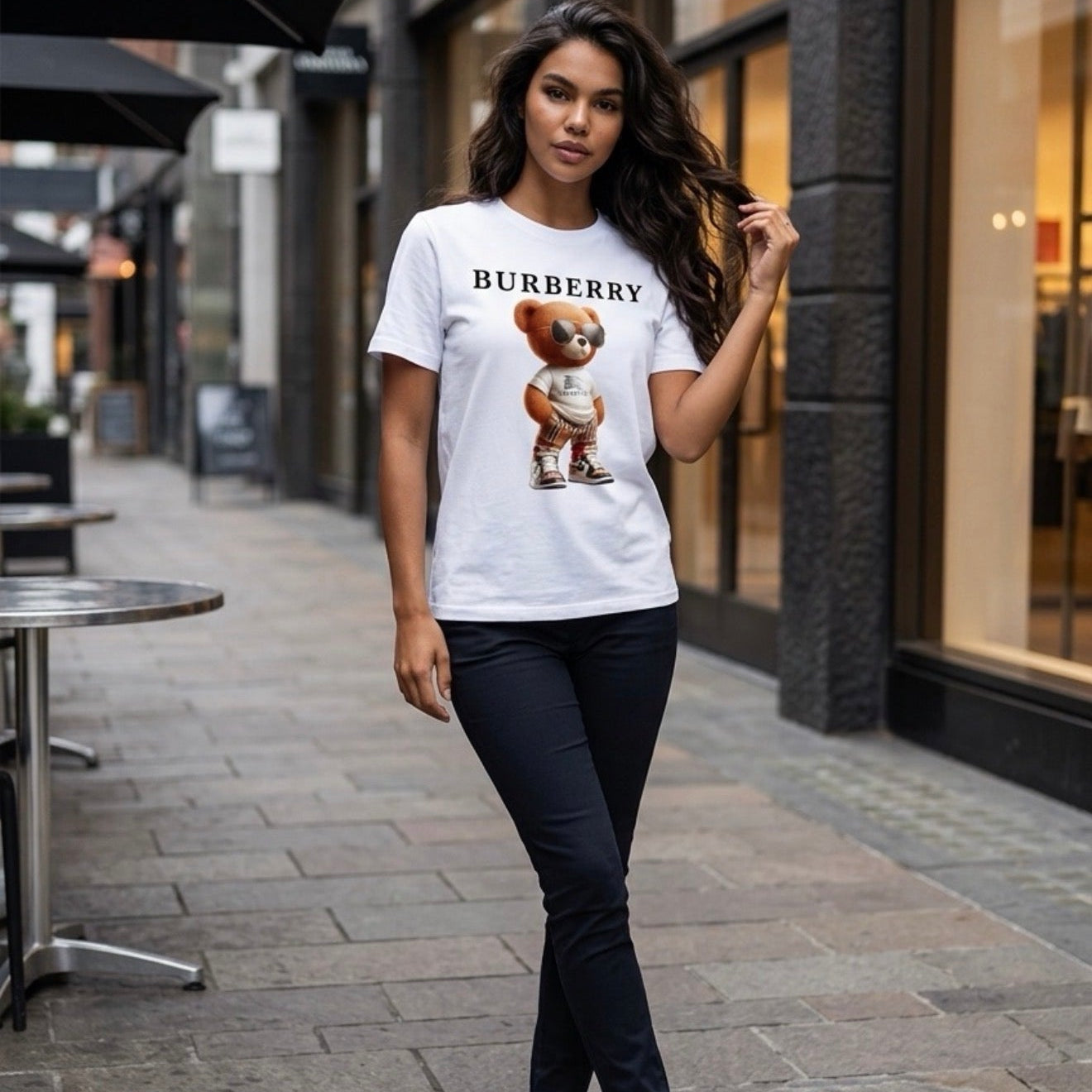 Woman wearing a Burberry t-shirt with a dog graphic on a city street.