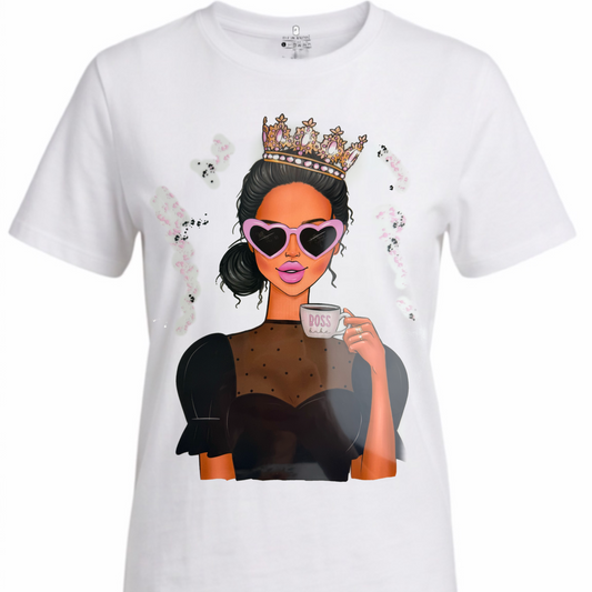 A white short-sleeve crewneck t-shirt featuring a large graphic print of a stylish woman with a gold crown, heart-shaped sunglasses, and a black dress holding a coffee cup.