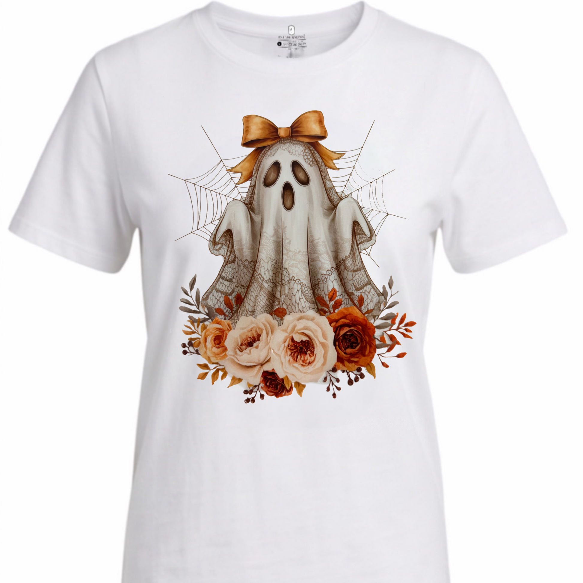 A white short-sleeve crewneck t-shirt featuring a central graphic of a cute cartoon ghost with a brown bow, surrounded by orange and pink roses, spiderwebs, and spider legs.